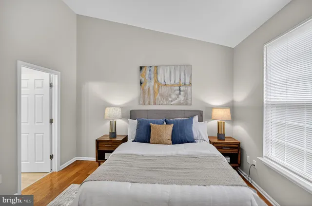 a bedroom with a bed and window