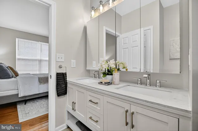 a bathroom with a sink and a mirror
