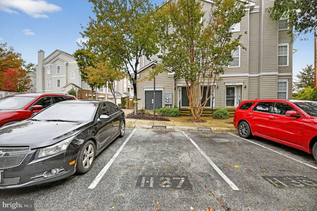 a view of a car park in front of house