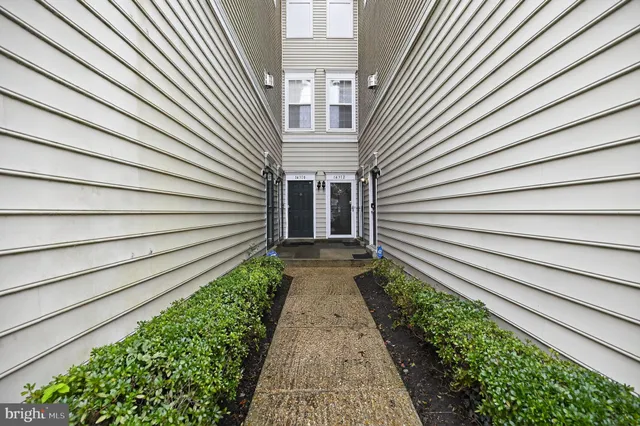 a view of a pathway with a balcony