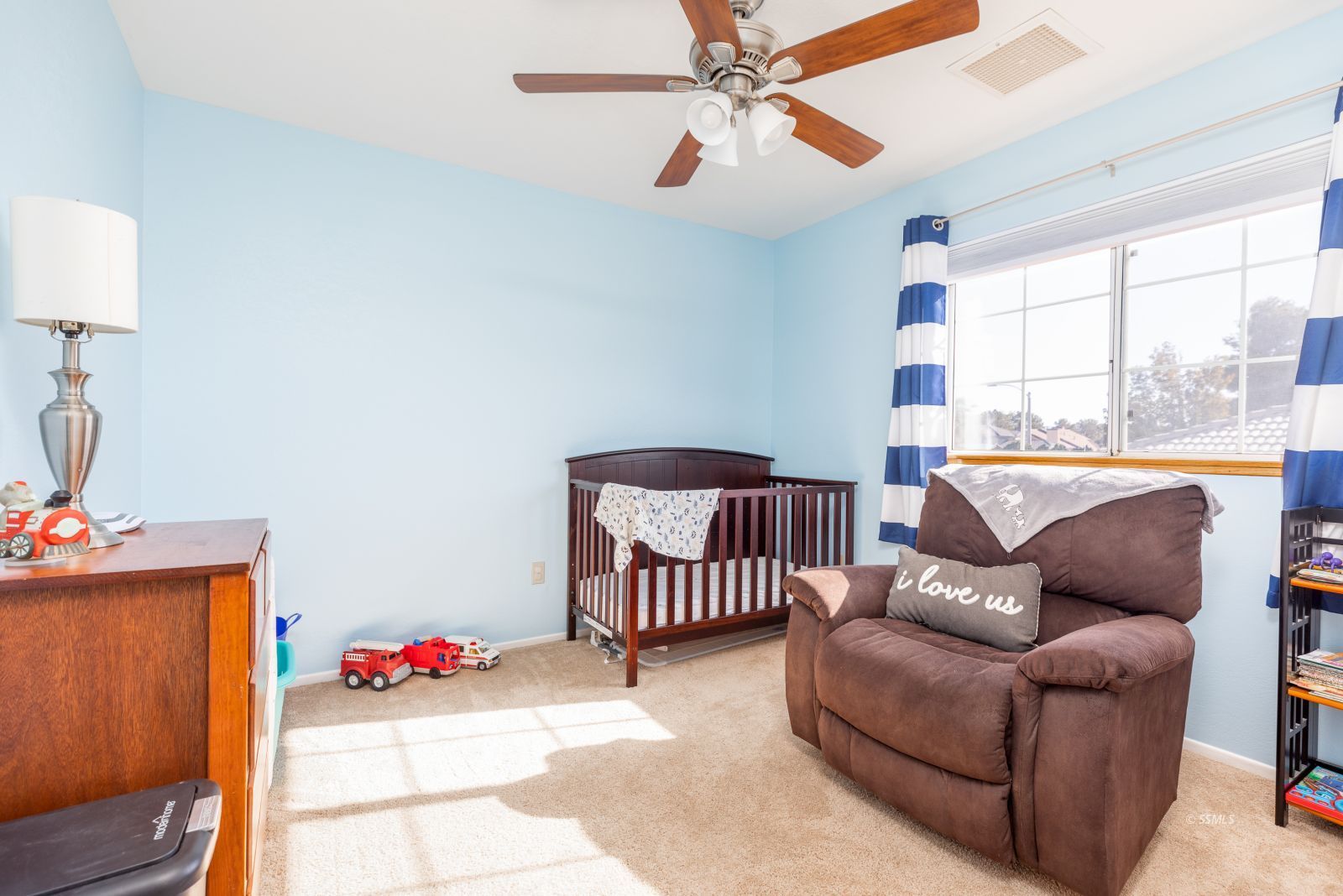 1047 Carolyn Street Ridgecrest, CA 93555 - Photo 24 of 35 a living room with furniture and a window