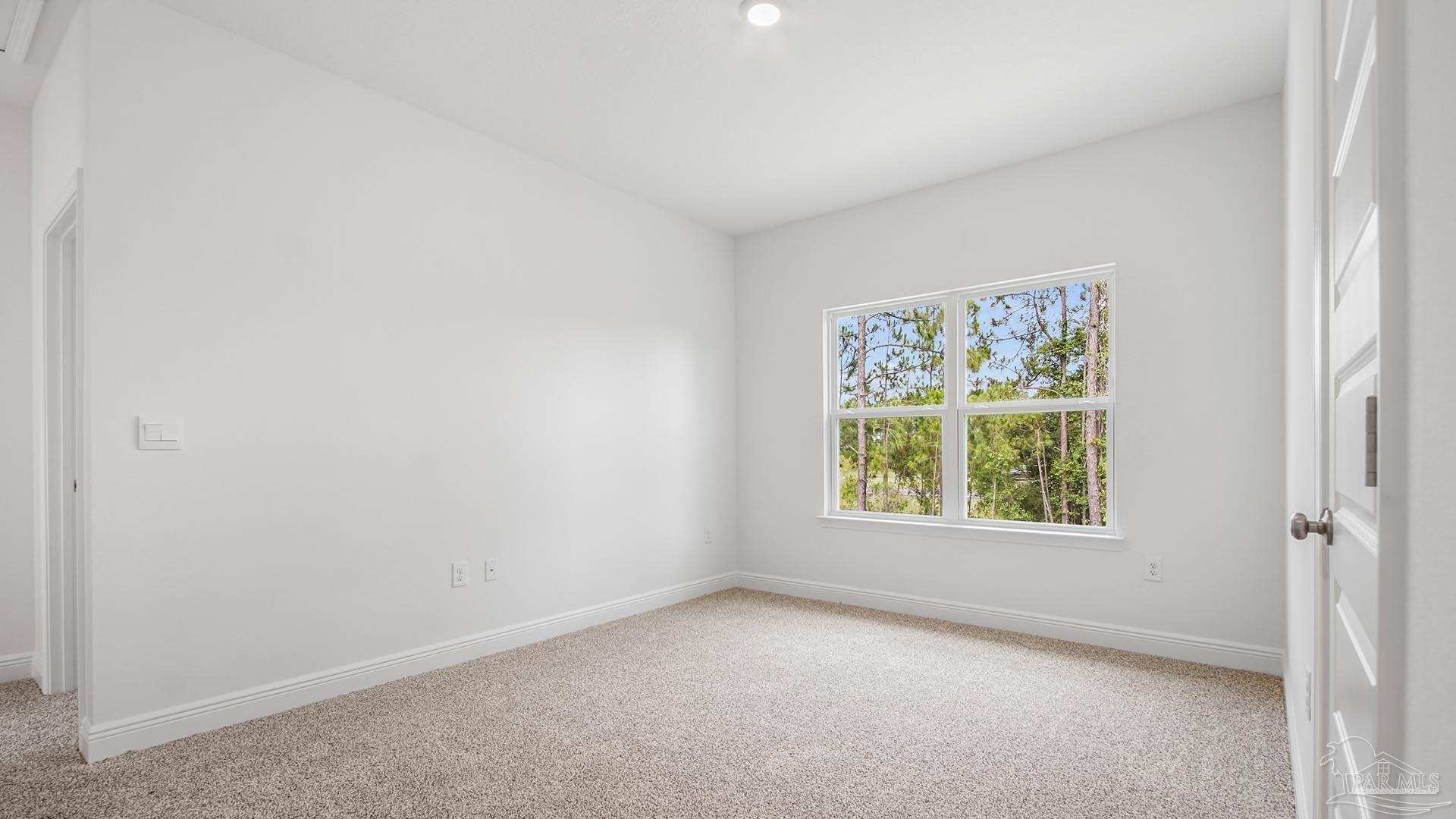 3233 Harrier Road Pace, FL 32571 - Photo 11 of 50 an empty room with a window