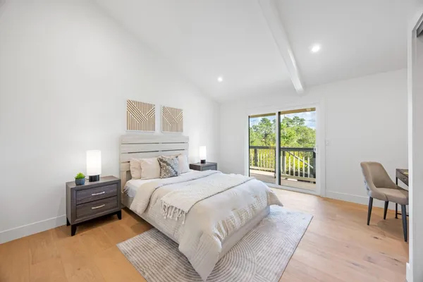 a bedroom with a bed and a couch