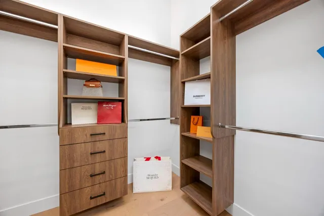 a view of balcony with two chairs and wooden fence