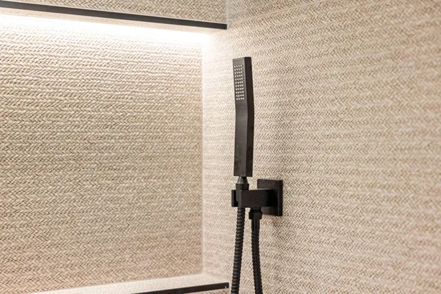 a view of a yard with plants and a bench