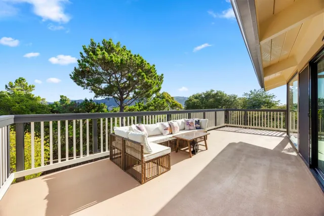 a view of a cars parked on the side of a street