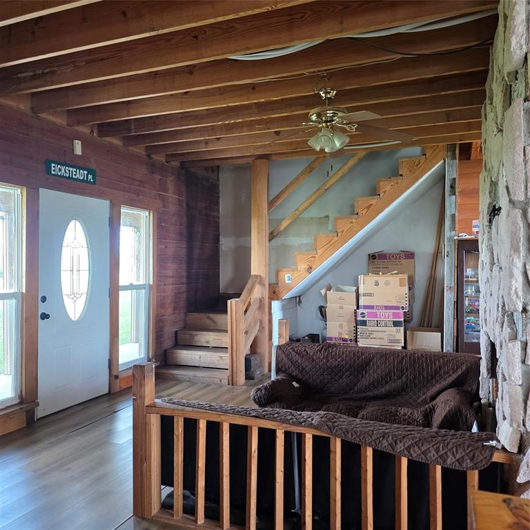 131 Hawk Ridge Decatur, TX 76234 - Photo 21 of 34 The interior features exposed wood beam ceilings and wood paneling