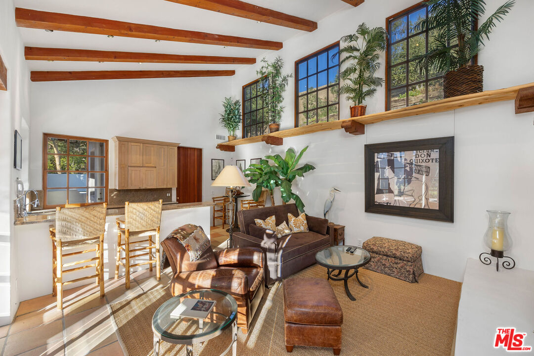 25127 Jim Bridger Road Hidden Hills, CA 91302 - Photo 38 of 50 a view of a livingroom with furniture and a potted plant