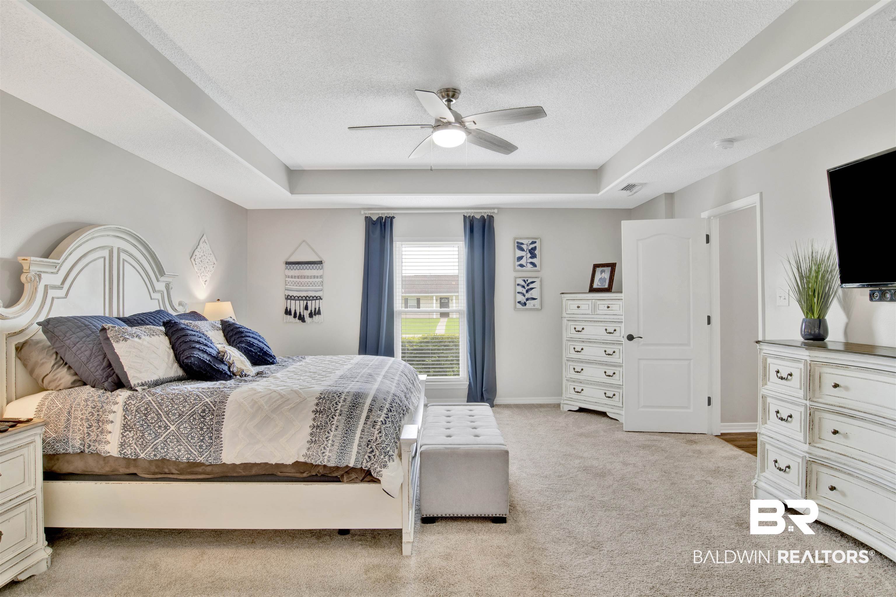 17483 East View Loop Foley, AL 36535 - Photo 20 of 30 Carpeted bedroom featuring a tray ceiling, a textured ceiling, and ceiling fan