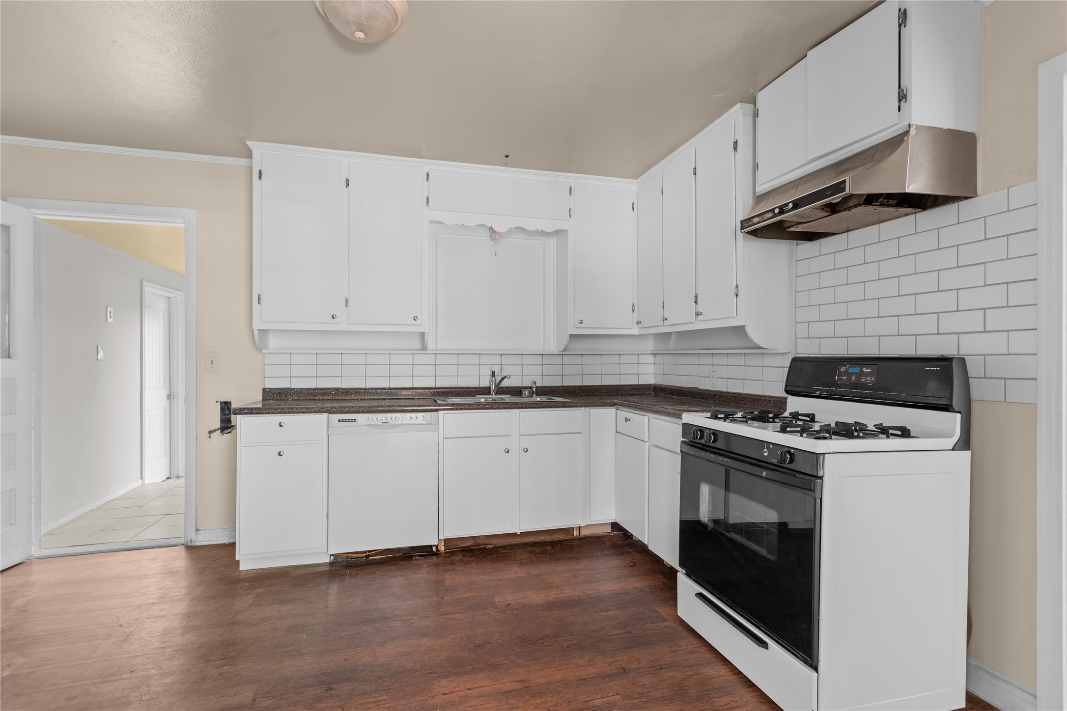 801 Evetts Road Killeen, TX 76541 - Photo 5 of 16 White cabinetry and appliances frame this kitchen, offering a seamless cooking experience.