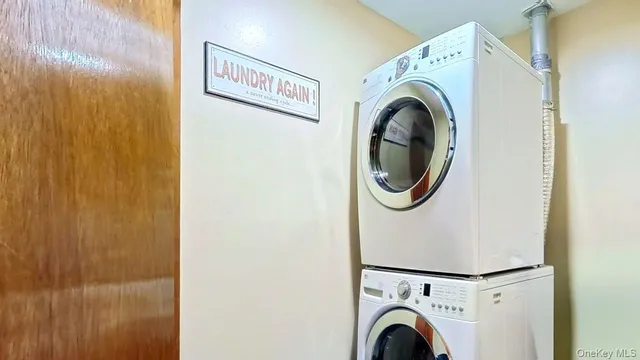 a view of a storage & utility room with washer and dryer