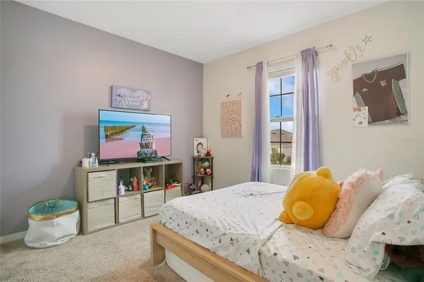 a bedroom with a bed and furniture