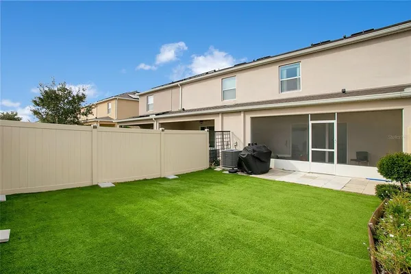 a view of a house with backyard