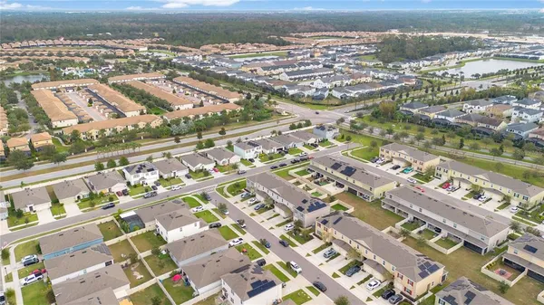 an aerial view of residential building and lake