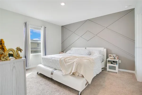 a bedroom with a bed and a cabinets