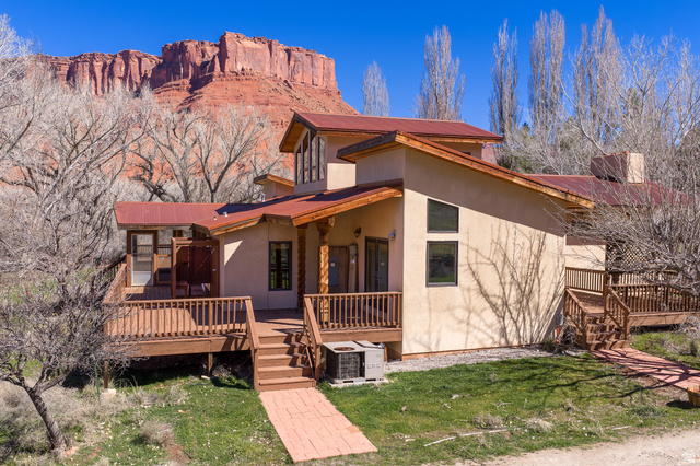 423 Amber Lane Moab, UT 84532 - Photo 40 of 63 West side of home with view of Parriott mesa