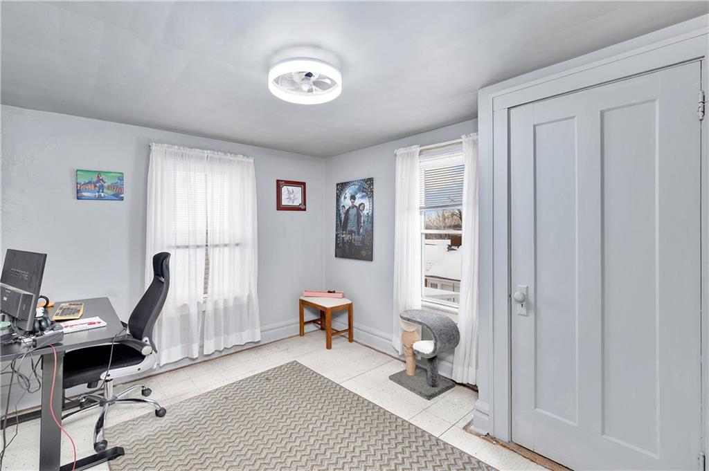 821 Vogan Street New Castle, PA 16101 - Photo 23 of 33 a view of a workspace with furniture and a window