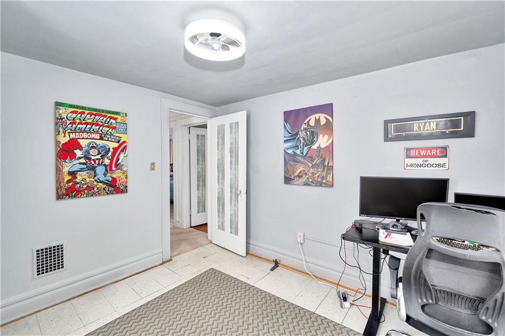 821 Vogan Street New Castle, PA 16101 - Photo 24 of 33 a view of a workspace with furniture and wooden floor