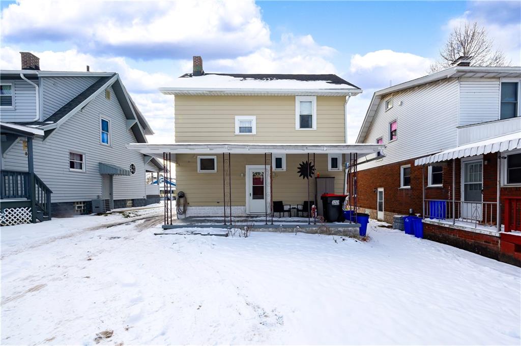 821 Vogan Street New Castle, PA 16101 - Photo 29 of 33 a view of a house with floor to ceiling windows