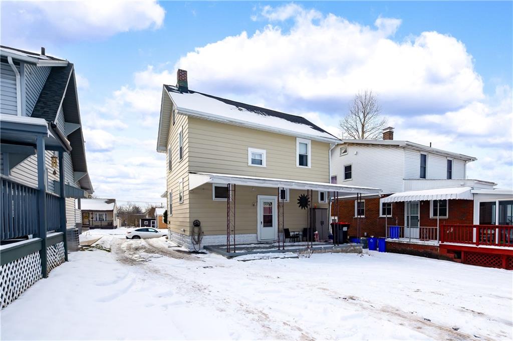 821 Vogan Street New Castle, PA 16101 - Photo 30 of 33 a view of a house with a yard and sitting area