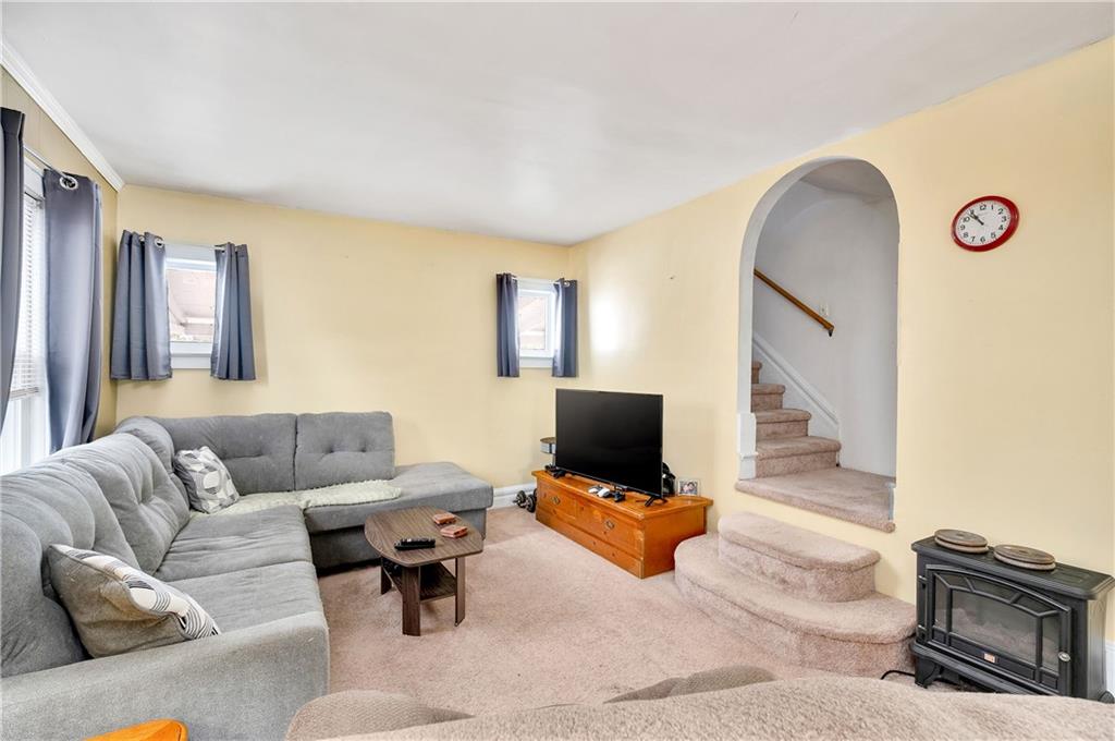 821 Vogan Street New Castle, PA 16101 - Photo 6 of 33 a living room with furniture and a flat screen tv