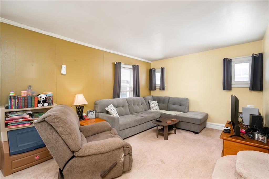 821 Vogan Street New Castle, PA 16101 - Photo 7 of 33 a living room with furniture and a flat screen tv