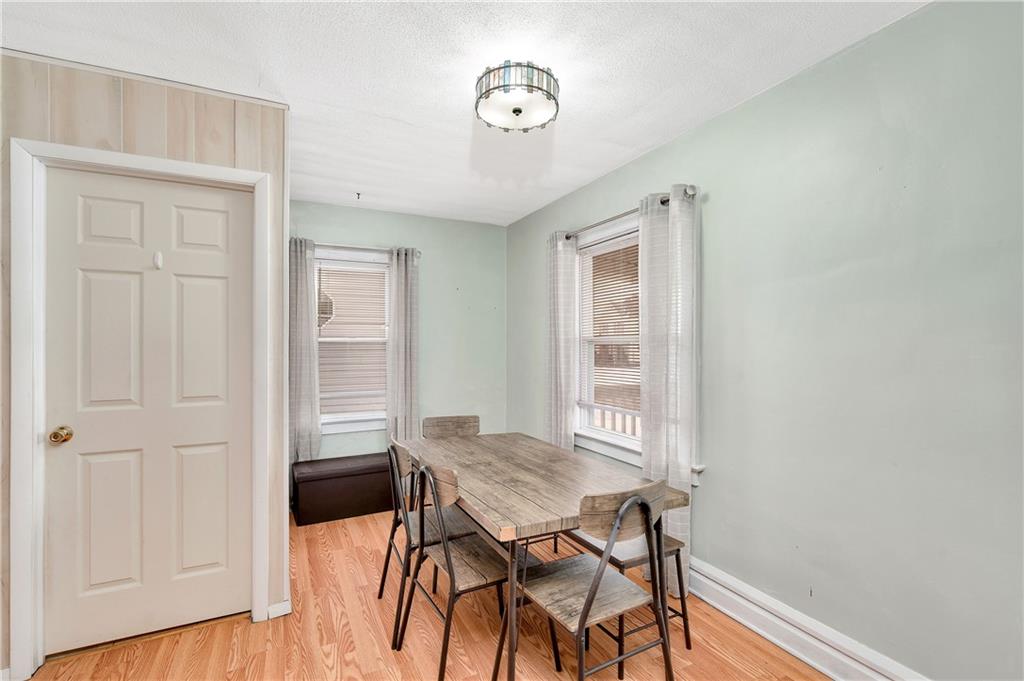 821 Vogan Street New Castle, PA 16101 - Photo 10 of 33 a view of a dining room with furniture and wooden floor