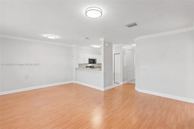 a view of kitchen with wooden floor