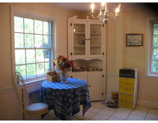 48 Nickerson Road Newton, MA 02467 - Photo 2 of 15 a table and chairs in a room