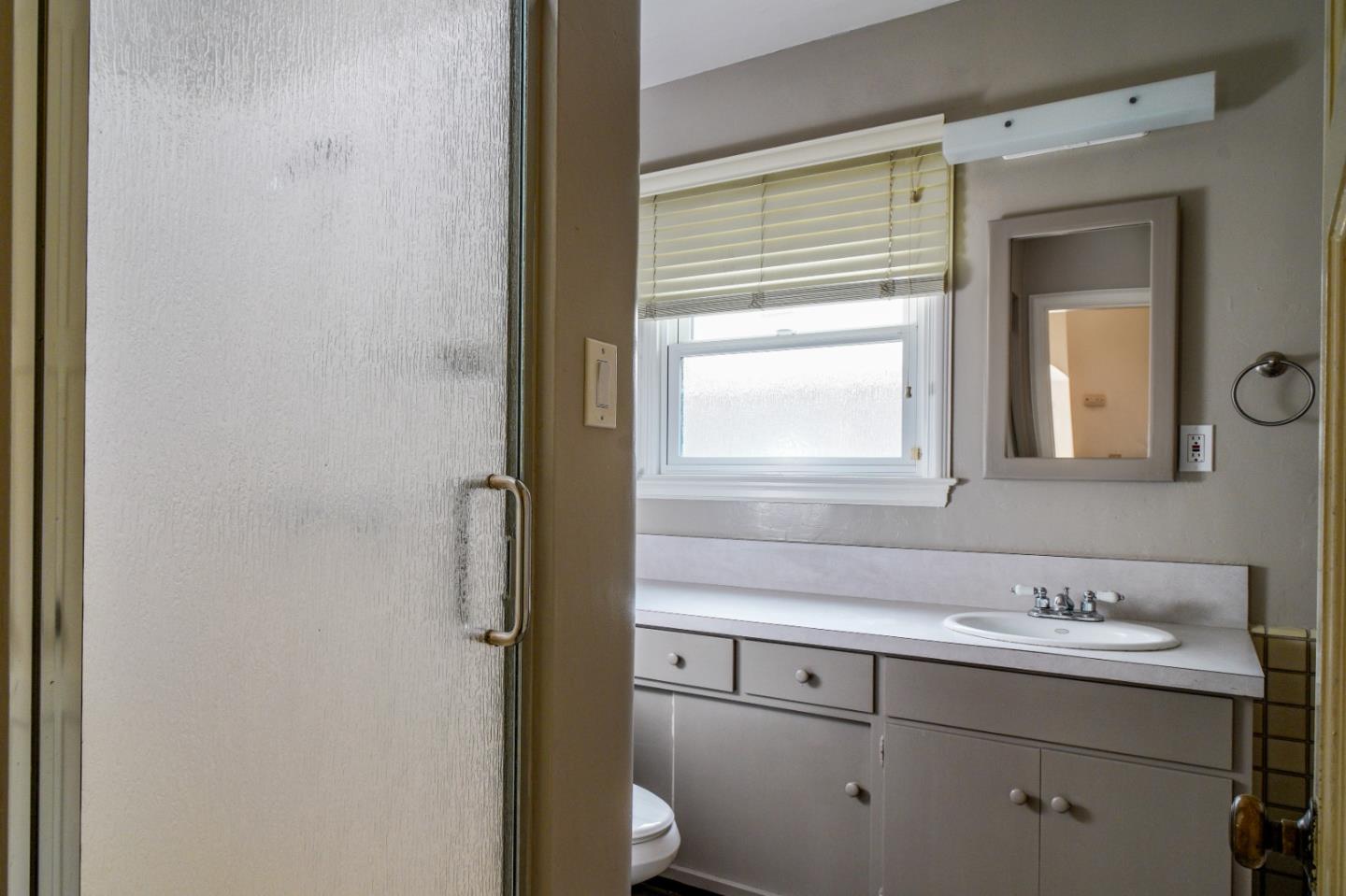 351 Lorimer Street Salinas, CA 93901 - Photo 12 of 37 a bathroom with a sink and a mirror