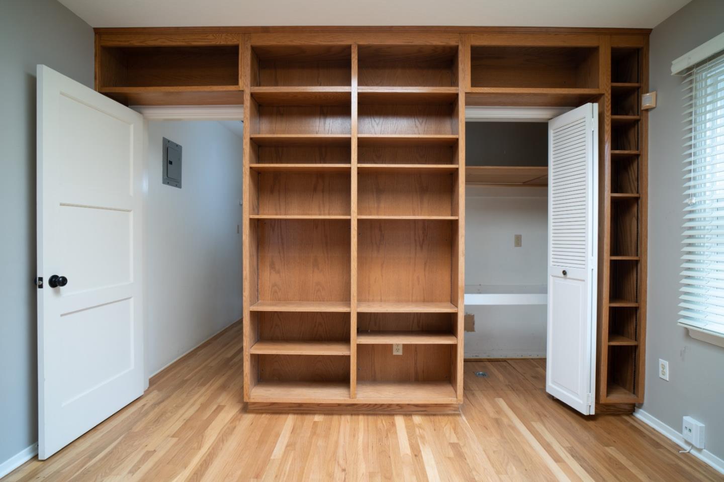 351 Lorimer Street Salinas, CA 93901 - Photo 13 of 37 a view of an empty room with wooden floor and a window