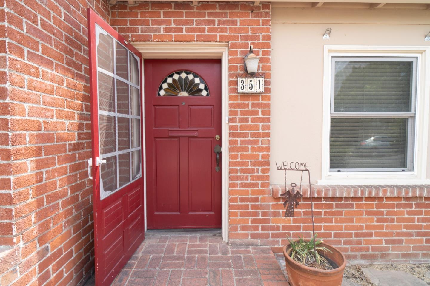 351 Lorimer Street Salinas, CA 93901 - Photo 2 of 37 a front view of a house with a potted plant