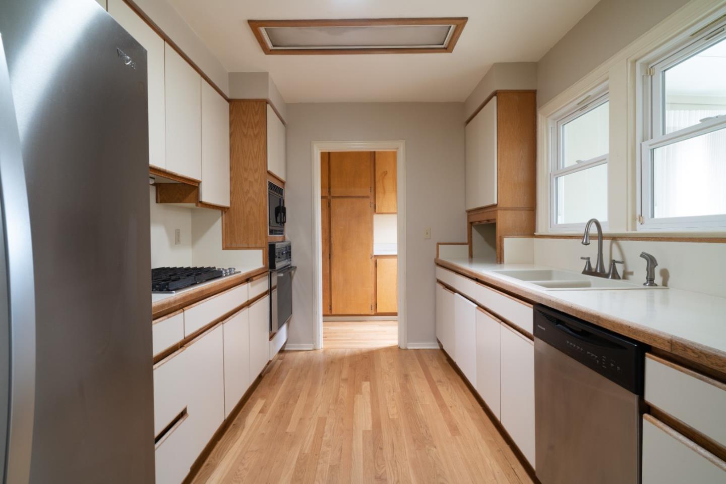 351 Lorimer Street Salinas, CA 93901 - Photo 8 of 37 a large kitchen with a sink and cabinets