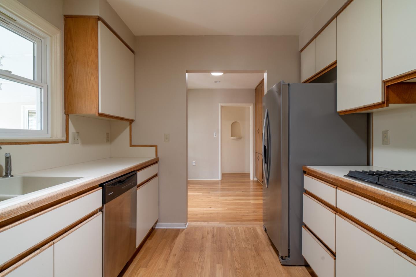 351 Lorimer Street Salinas, CA 93901 - Photo 9 of 37 a kitchen with stainless steel appliances granite countertop a sink and a stove
