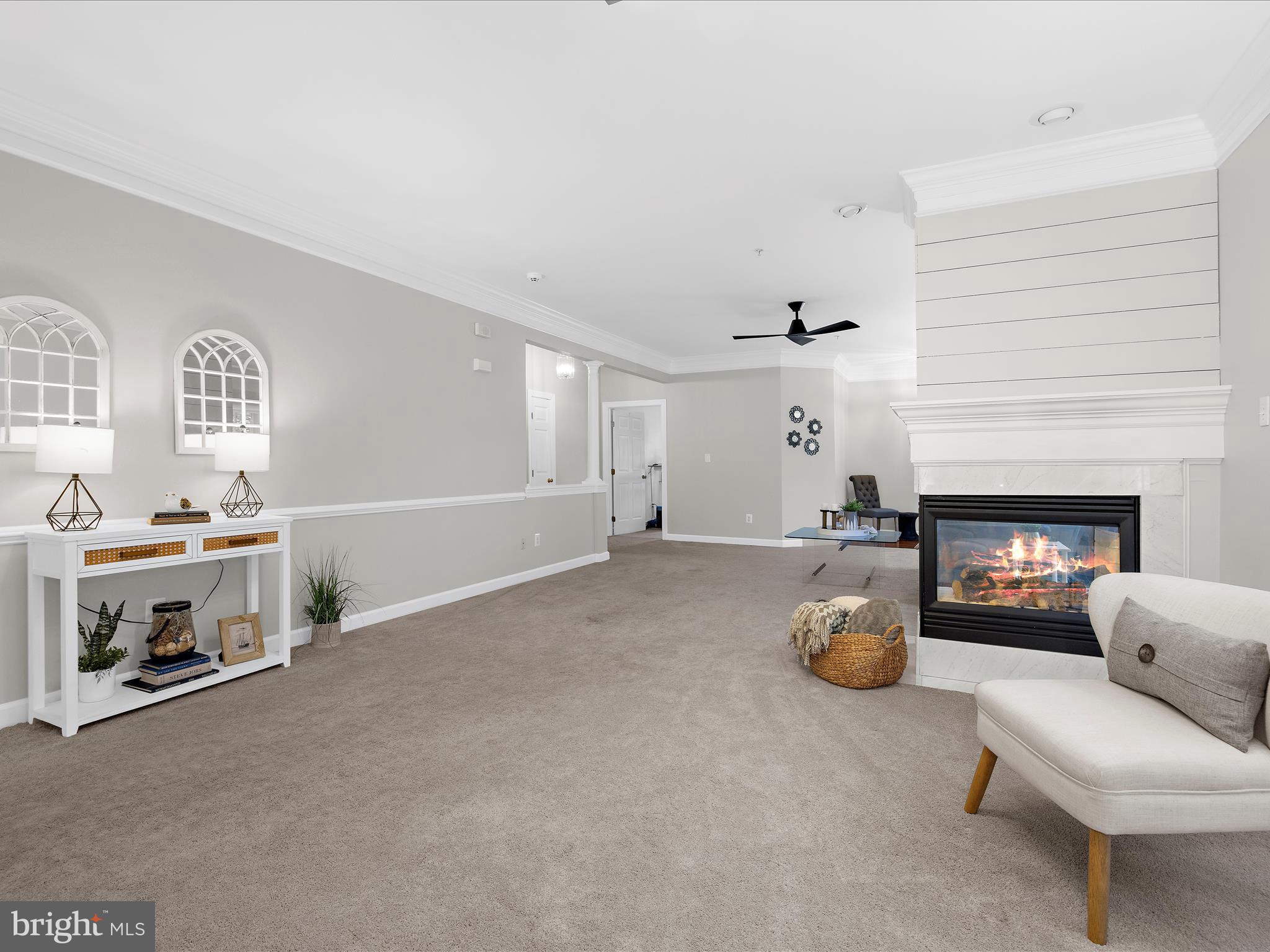 301 Colony Point Place Edgewater, MD 21037 - Photo 10 of 45 a living room with furniture and a fireplace