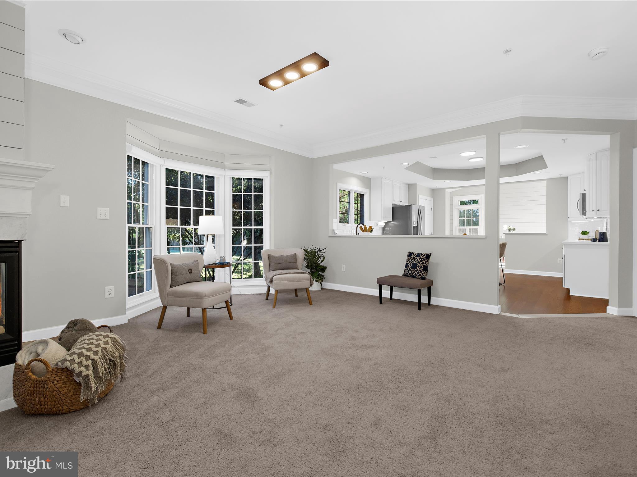 301 Colony Point Place Edgewater, MD 21037 - Photo 12 of 45 a living room with furniture and a large window