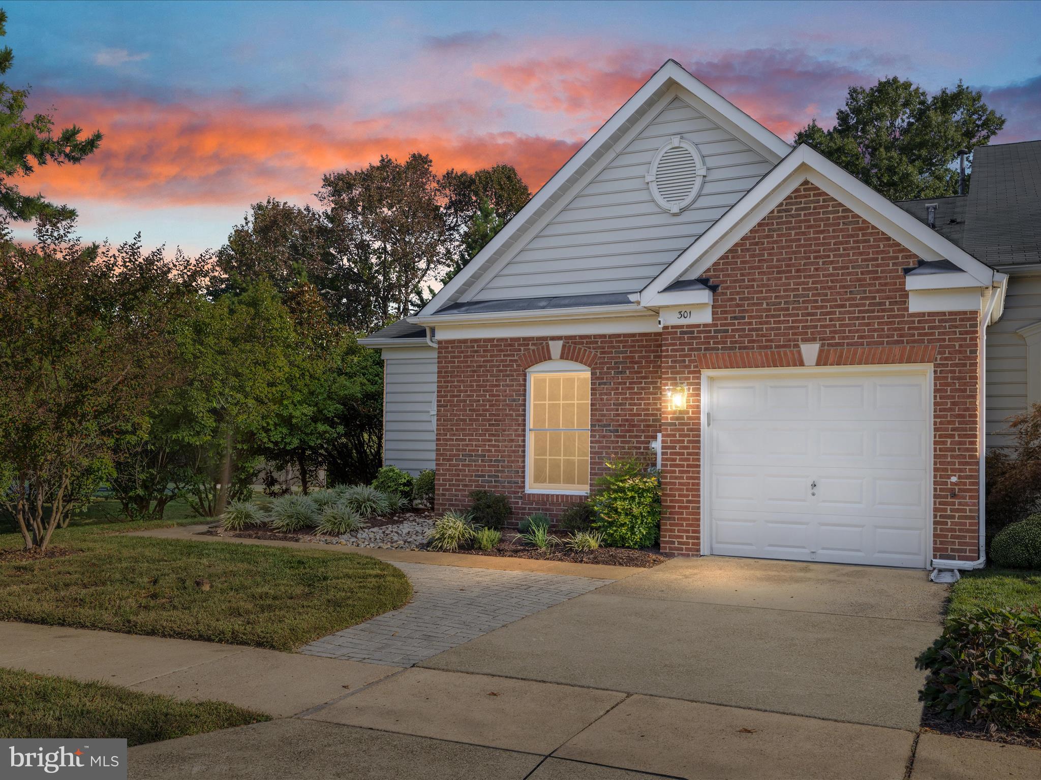 301 Colony Point Place Edgewater, MD 21037 - Photo 2 of 45 a view of a house with garage and plants