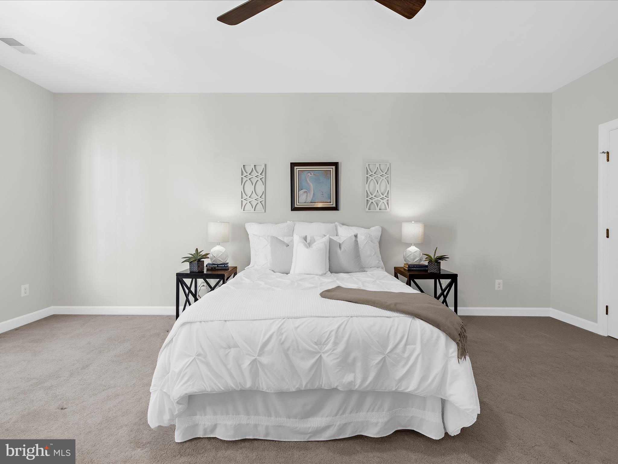 301 Colony Point Place Edgewater, MD 21037 - Photo 23 of 45 a bedroom with a bed and a night stand