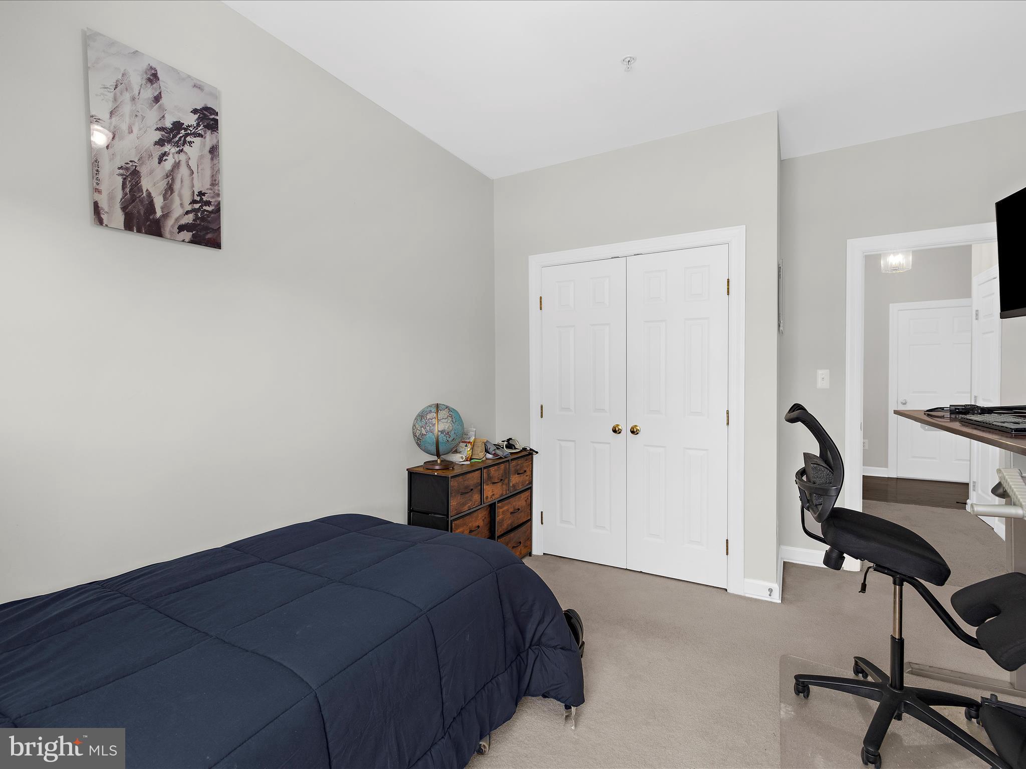 301 Colony Point Place Edgewater, MD 21037 - Photo 29 of 45 a bedroom with a bed and a chair