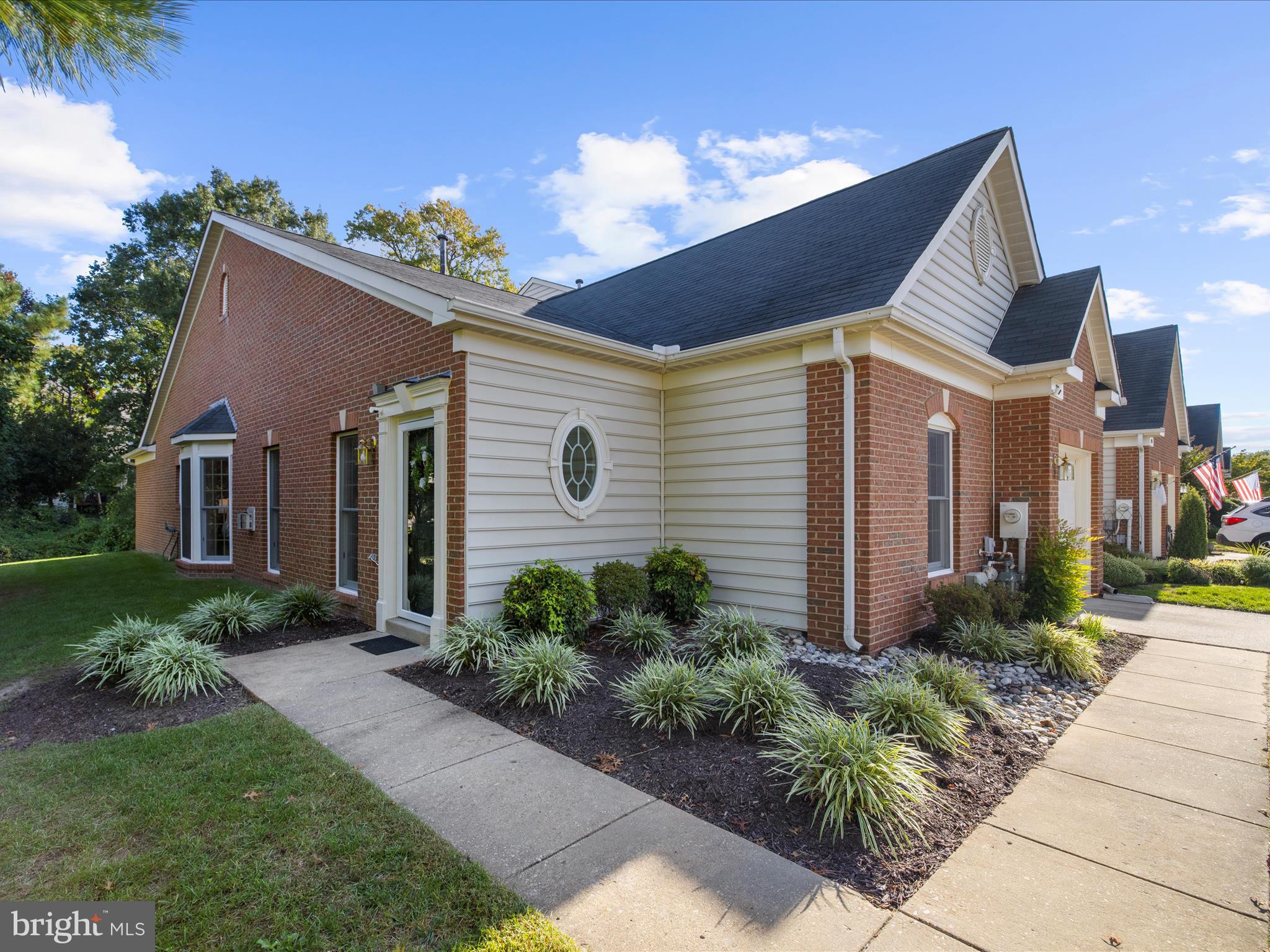 301 Colony Point Place Edgewater, MD 21037 - Photo 3 of 45 a front view of a house with garden