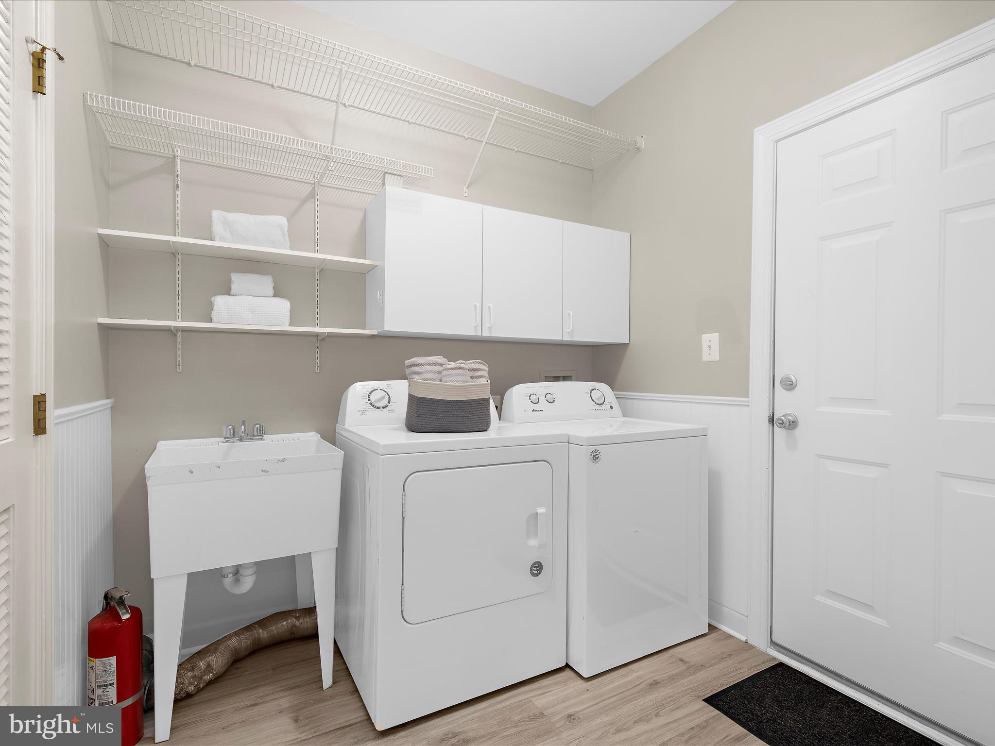 301 Colony Point Place Edgewater, MD 21037 - Photo 32 of 45 a utility room with dryer and washer