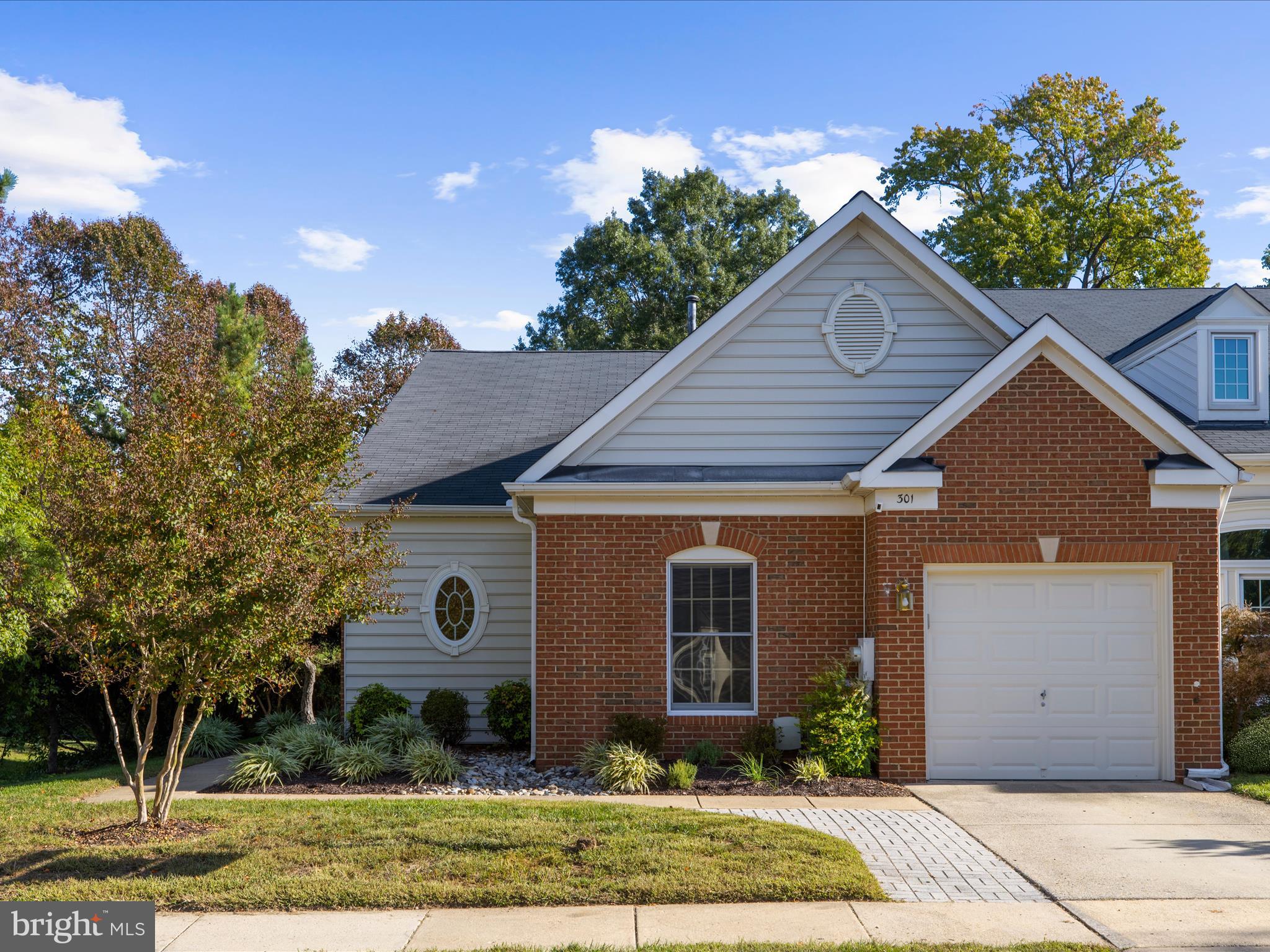 301 Colony Point Place Edgewater, MD 21037 - Photo 39 of 45 a front view of a house with garden