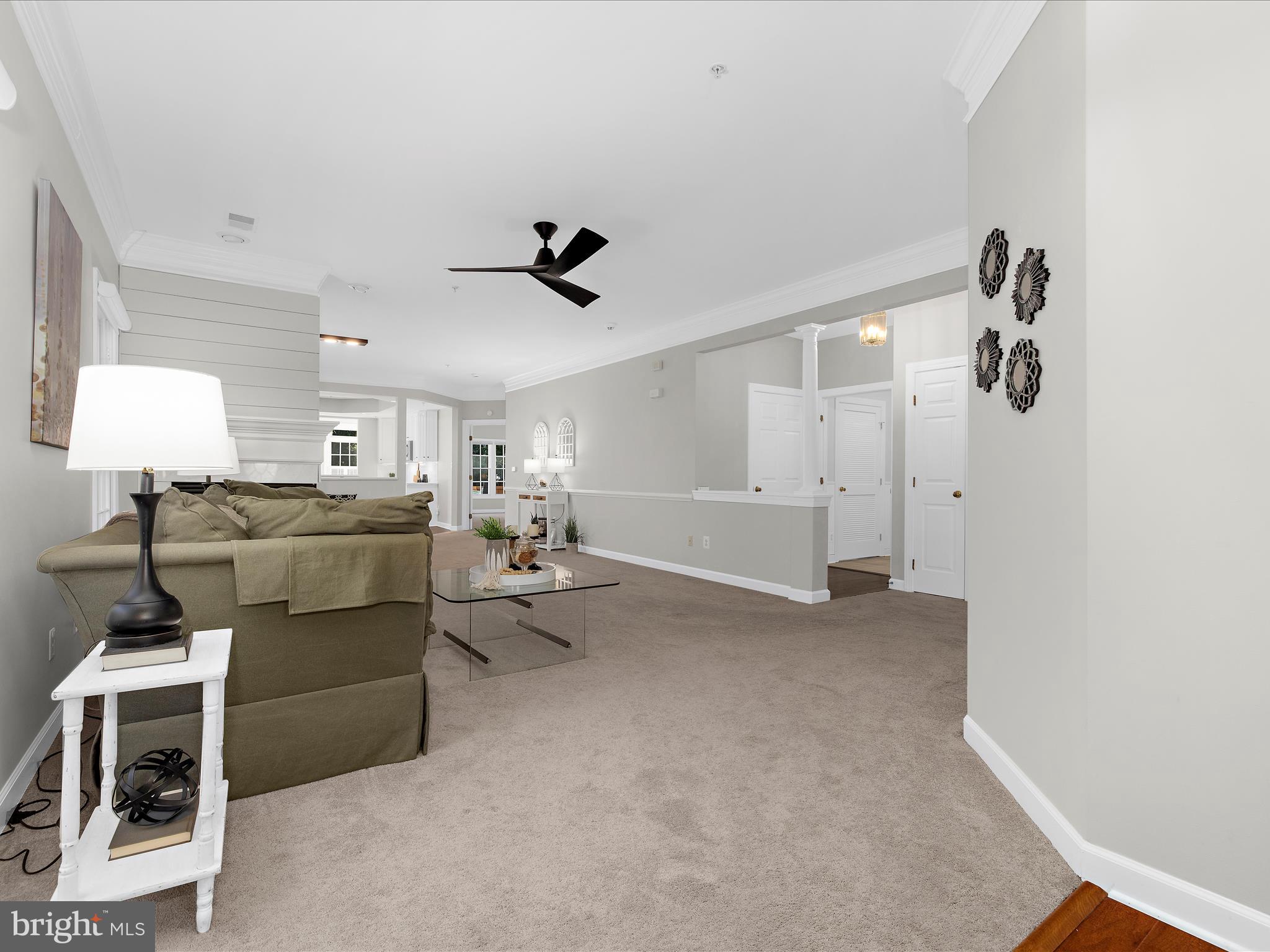 301 Colony Point Place Edgewater, MD 21037 - Photo 43 of 45 a living room with furniture and a ceiling fan