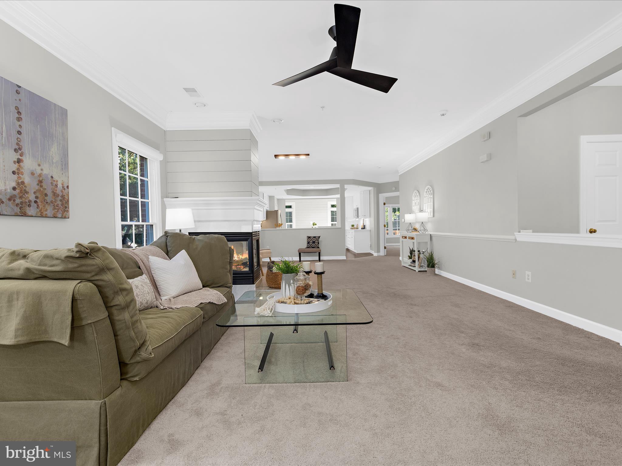 301 Colony Point Place Edgewater, MD 21037 - Photo 6 of 45 a living room with furniture and a wooden floor