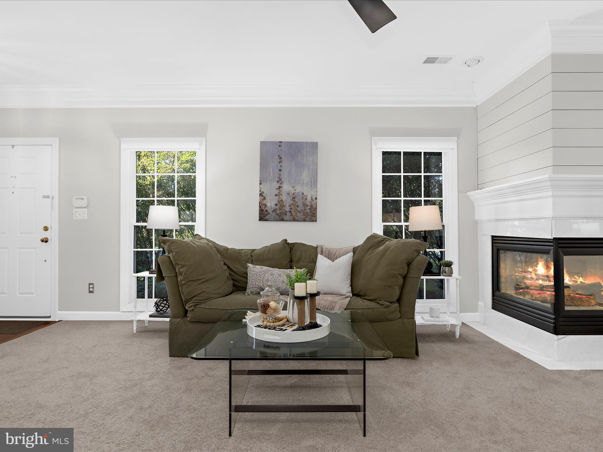 301 Colony Point Place Edgewater, MD 21037 - Photo 8 of 45 a living room with furniture and a fireplace