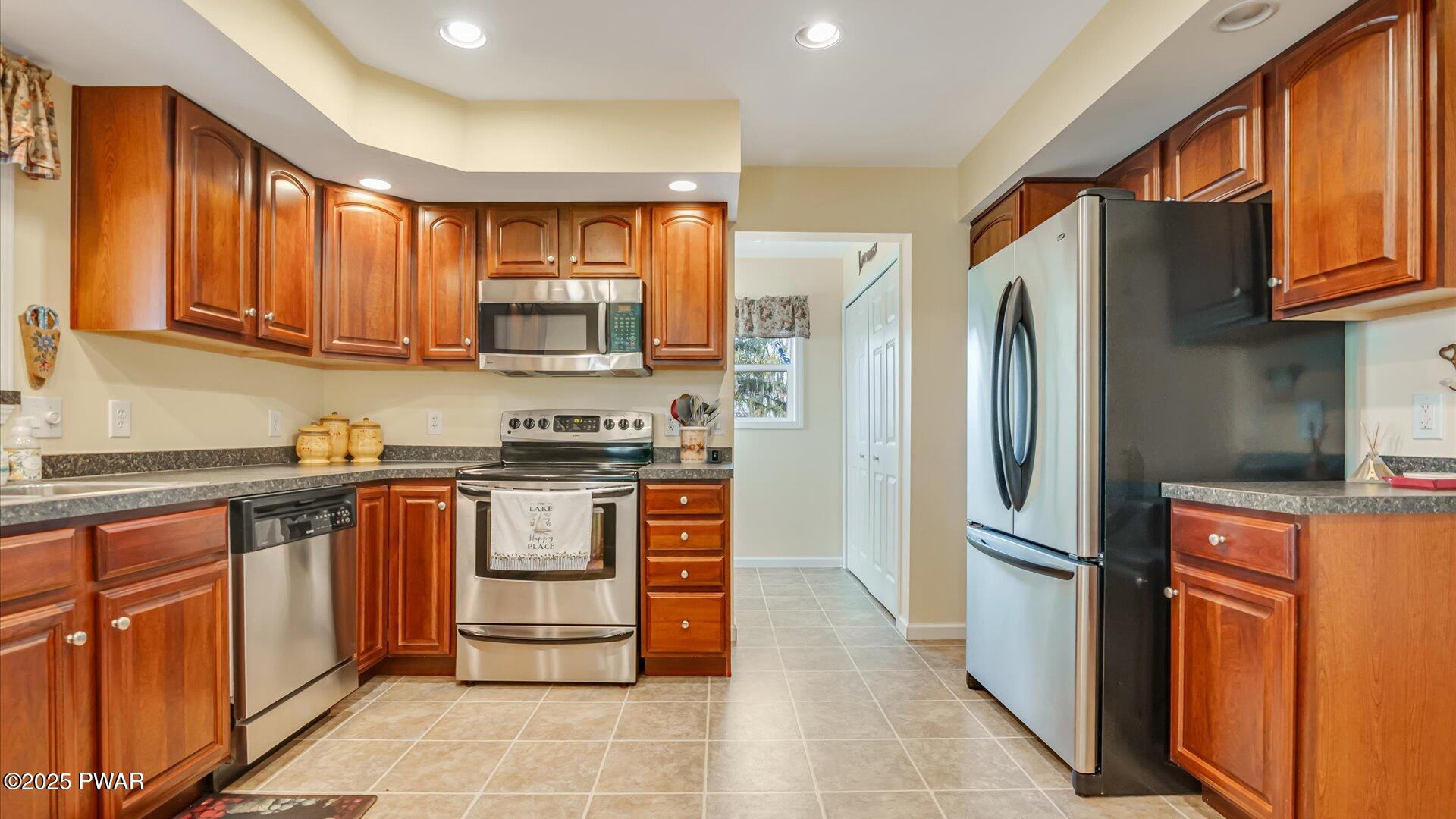 66 Boulder Road Lake Ariel, PA 18436 - Photo 12 of 51 a kitchen with stainless steel appliances granite countertop a refrigerator stove top oven and sink