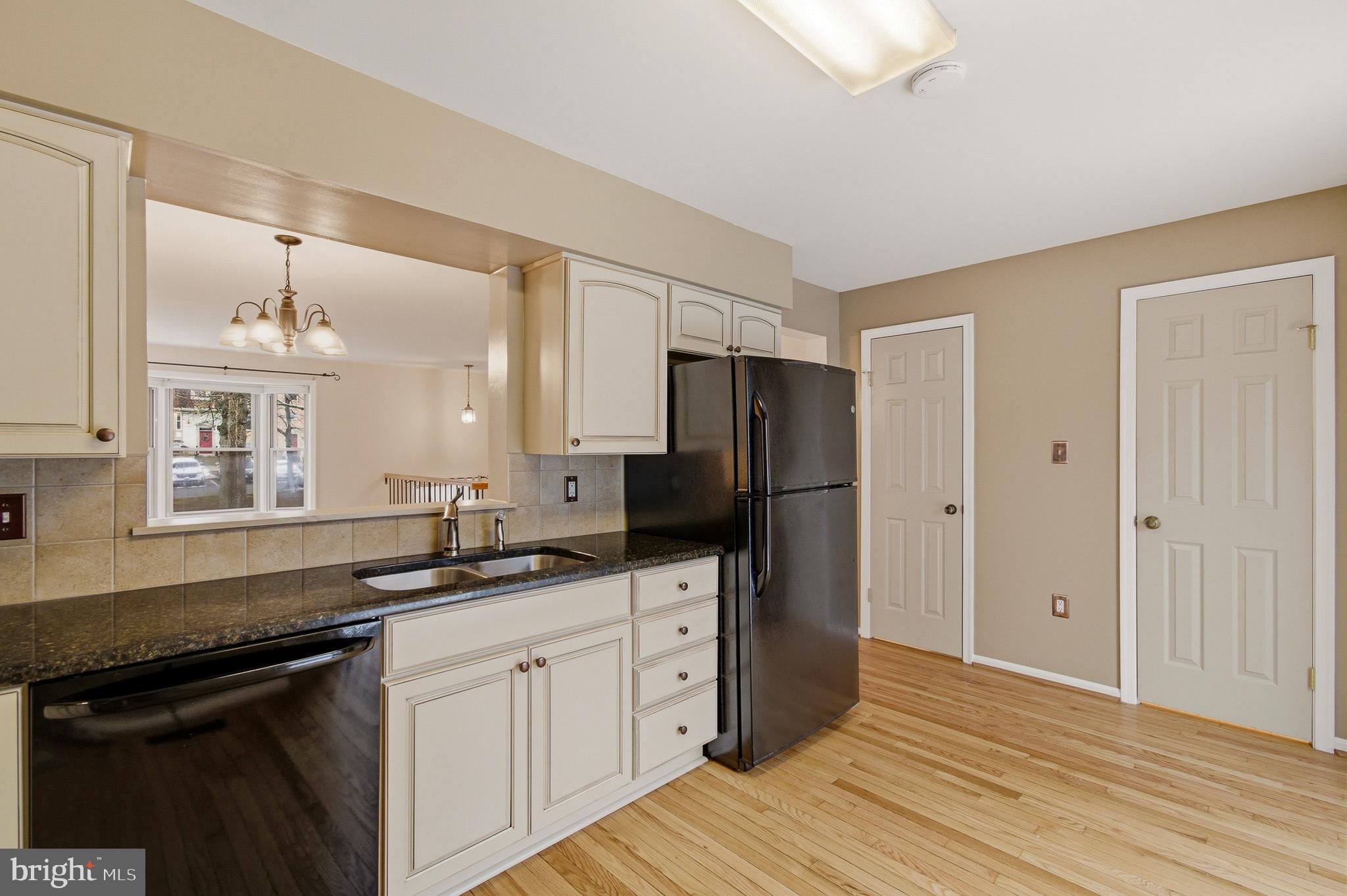2036 Howard Chapel Turn Crofton, MD 21114 - Photo 15 of 55 a kitchen with a sink a refrigerator and cabinets