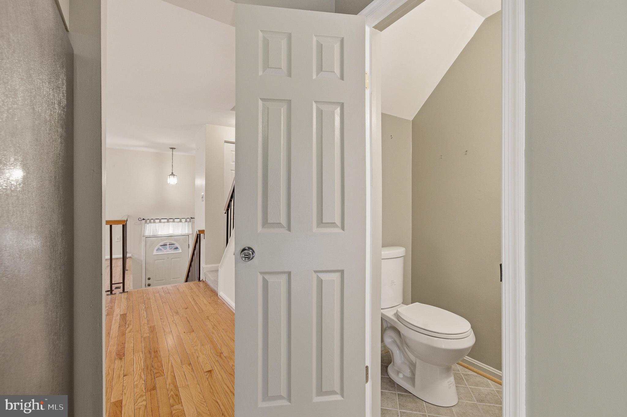 2036 Howard Chapel Turn Crofton, MD 21114 - Photo 22 of 55 a white toilet sitting next to a bathroom sink