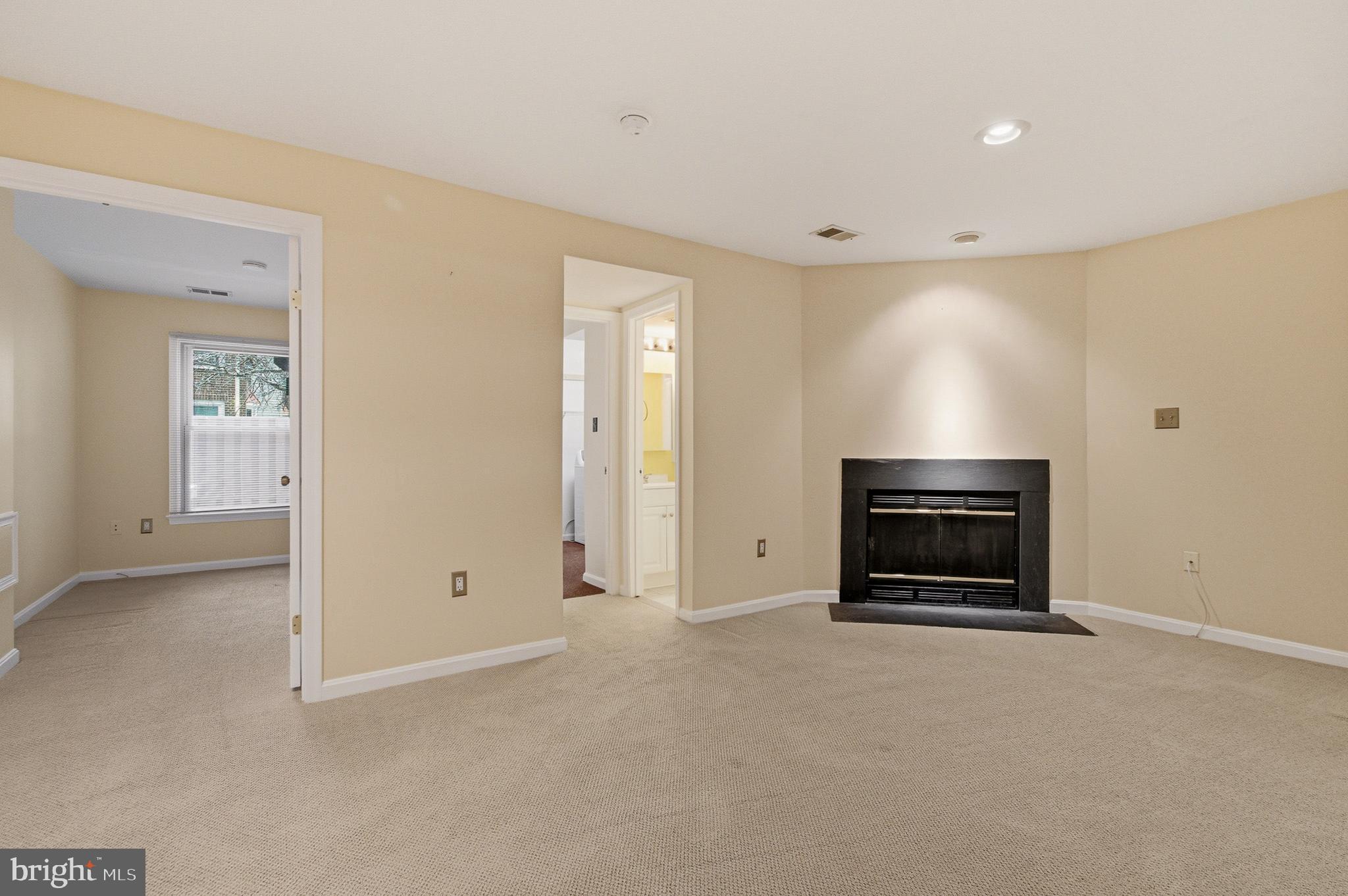 2036 Howard Chapel Turn Crofton, MD 21114 - Photo 39 of 55 a view of empty room with a fireplace and cabinet