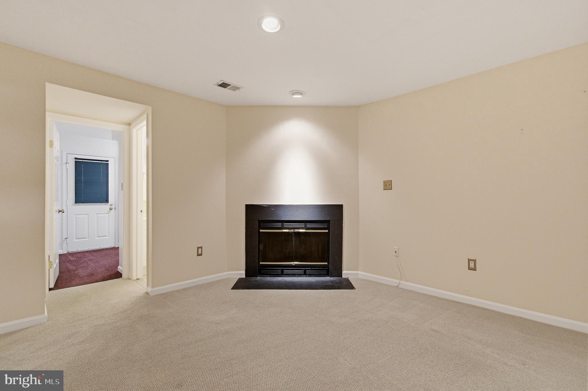 2036 Howard Chapel Turn Crofton, MD 21114 - Photo 40 of 55 a view of empty room with a fireplace